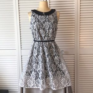 White material over black, with Bermuda collar.